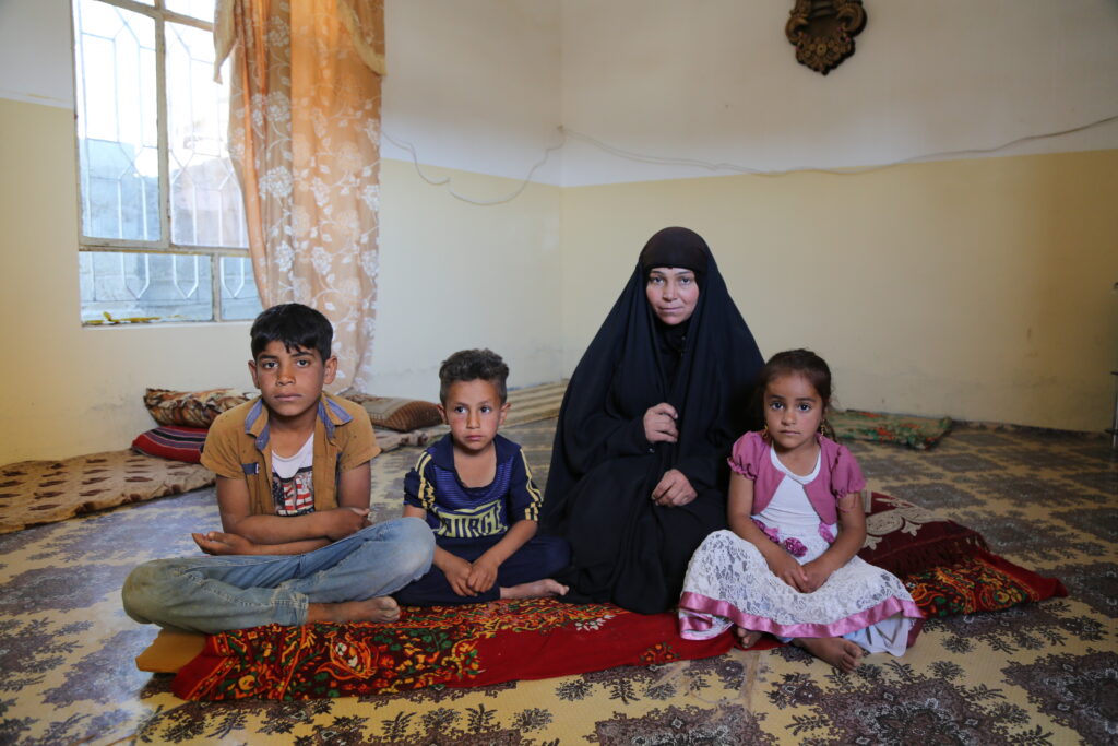 Um Muhammed and her children from Iraq, one of the recipients of the Ramadan food program. 