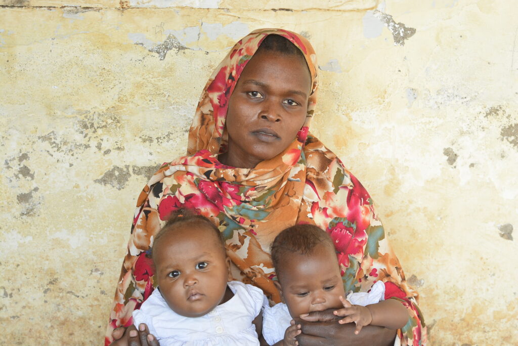 Gesma (23), a mother of four, displaced by the ongoing conflict in Sudan.