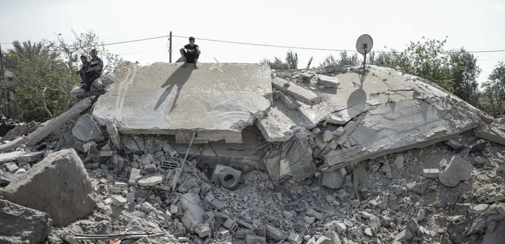 Civilians sitting on top rubble. Hundreds of thousands of people are affected by the evacuation orders as Israel’s attack on Rafah, Gaza intensifies. 