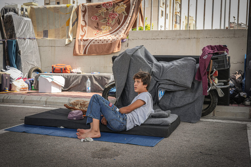 displaced person in Lebanon on mattress