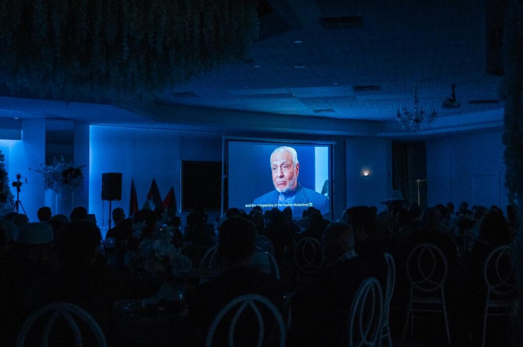 Attendees fully engaged with the powerful documentary created by Bilal 