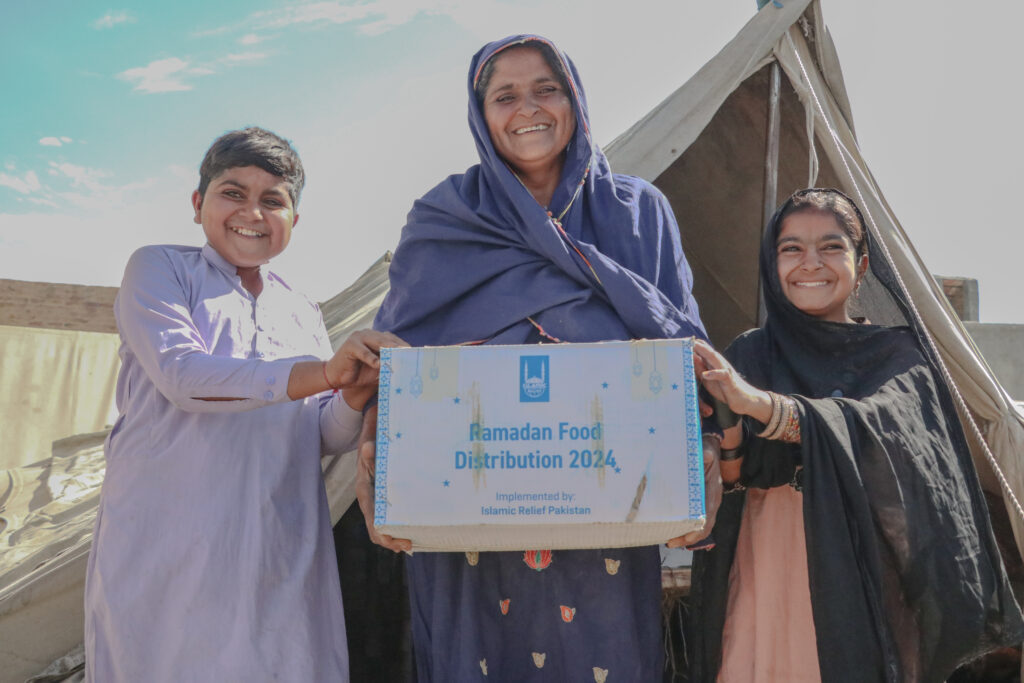 A family in need in Pakistan receiving a food pack for Ramadan and to receive one for Zakat al-Fitr (Zakat ul-Fitr)