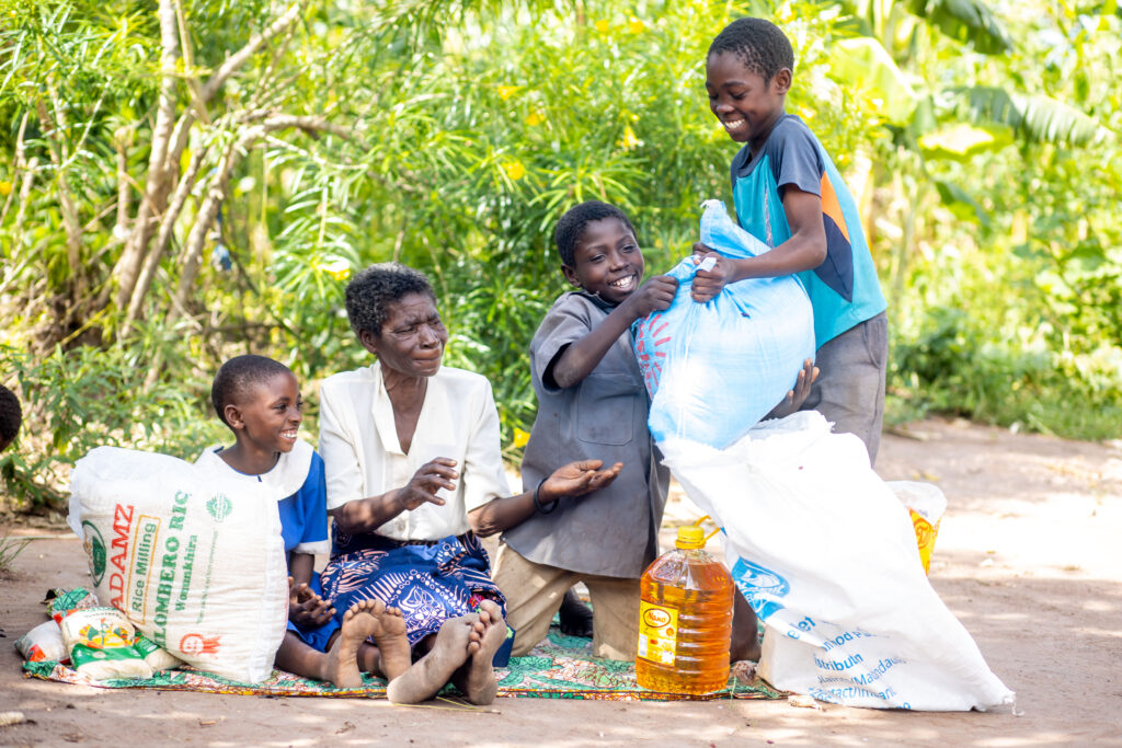 A family in need in Malawi with food supplied by Islamic Relief for their iftar