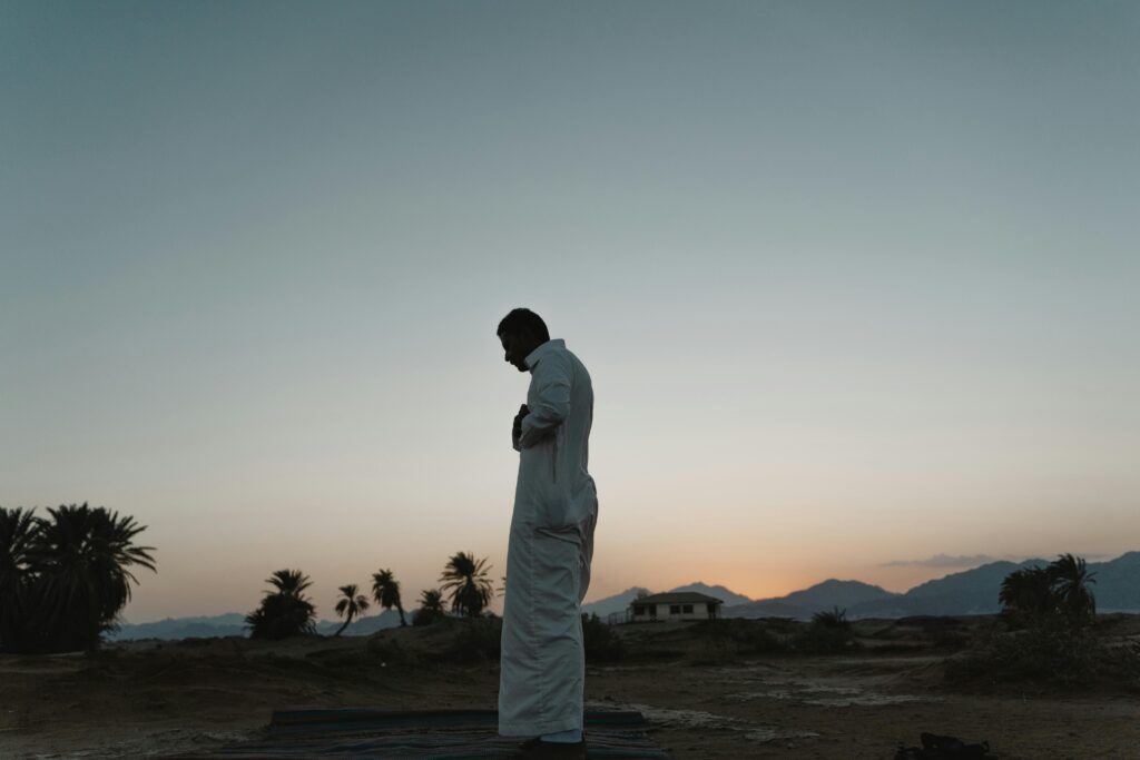 Muslim man standing in prayer (salah), one of the five pillars of Islam