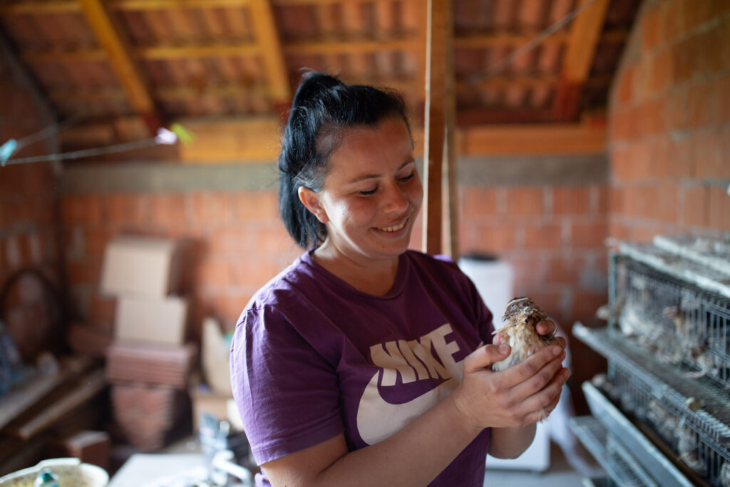 Adelina with the quails she received through an Islamic Relief livelihoods project 