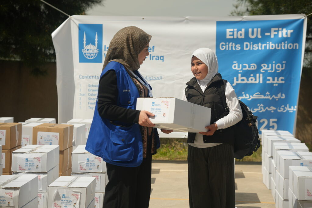 Young girl receiving an eid gift for Eid Al Fitr