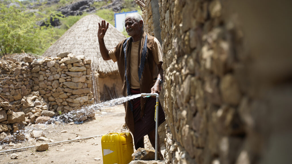 Ibrahim retrieving water in his village in Yemen