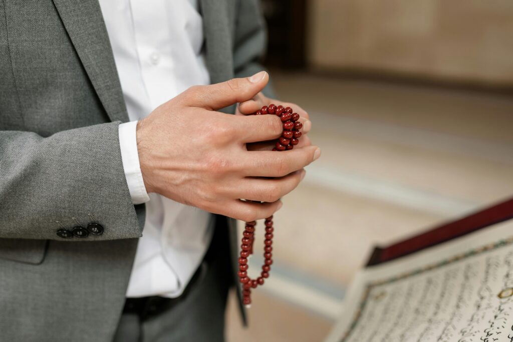 man holding tasbih, showing discipline and love for Allah SWT