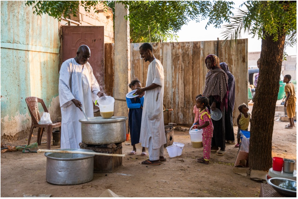 Mohamed at the Al-Thawra community kitchen in Khartoum feeding people, which has operated continuously for three years.